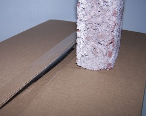 3-lb. brick easily seperates tape from box