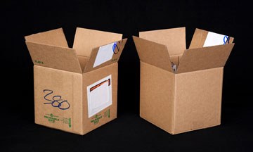 The reusable shipping box after initial shipment, and pictured again after it is inverted for a second use.