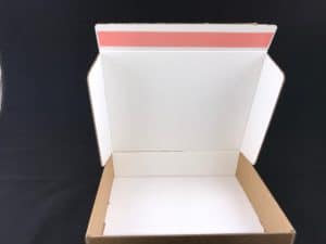 two way box with primary adhesive strip removed.